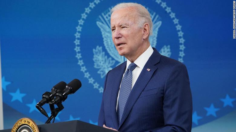 A gravelly voiced President Biden says he has a cold