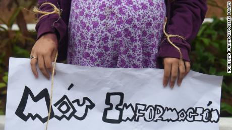 A pregnant teenager holds a sign that reads: &quot;More Information, Better Protection&quot; at a National Child Sexual Exploitation and Abuse Awareness Day demonstration, in Asuncion, Paraguay in 2017.