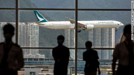 A Cathay Pacific aircraft comes in to land at Hong Kong International Airport on August 11, 2021. (Photo by ISAAC LAWRENCE / AFP) (Photo by ISAAC LAWRENCE/AFP via Getty Images)