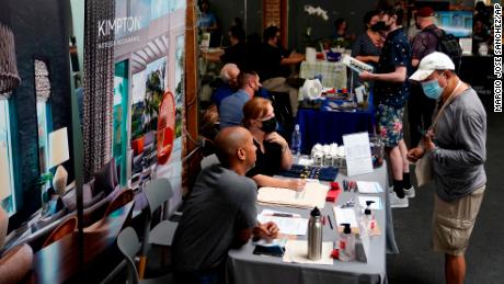 Prospective employers and job seekers interact during a job fair Wednesday, Sept. 22, 2021, in the West Hollywood section of Los Angeles.