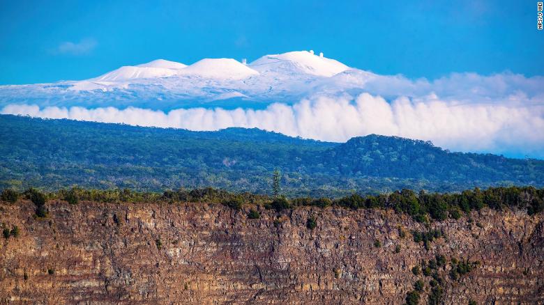 Snow capped Mauna Kea on November 30, 2021 taken from Hawaii Volcanoes National Park.