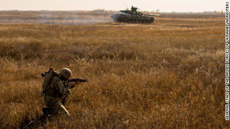 A member of the Ukrainian Armed Forces takes part in military drills at a training ground near the border with Russian-annexed Crimea in Kherson region, Ukraine, on November 17, 2021. 