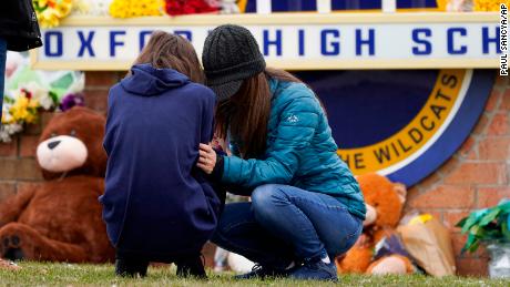 Police are searching for the parents of the suspect in the Michigan High School shooting after they were charged with involuntary manslaughter.