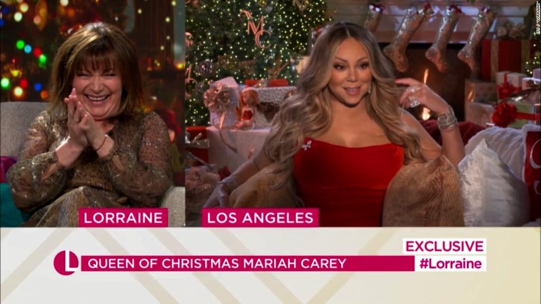 Mariah Carey says she needed 'six grown men' to carry her Christmas dress