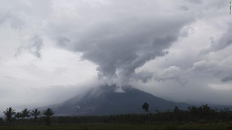 Volcano rescue workers dig through thick layers of hot ash in Indonesia after Mount Semeru erupts