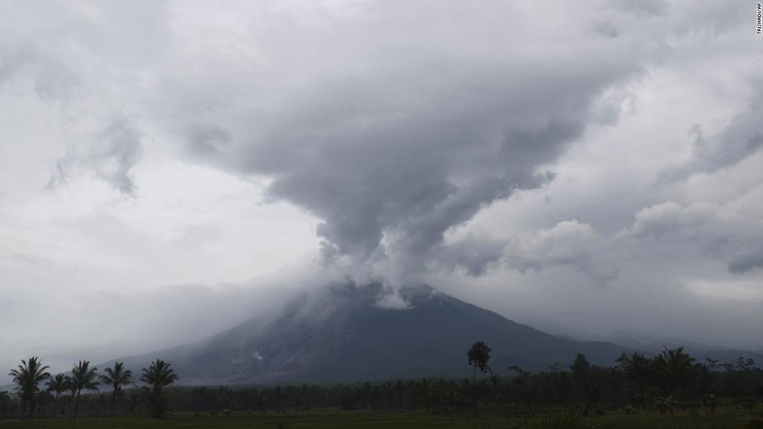 Volcano rescue workers dig through thick layers of hot ash in Indonesia after Mount Semeru erupts