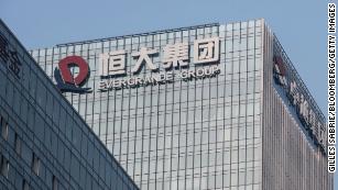 Evergrande shares plummet 20% to new record low as default fears resurface