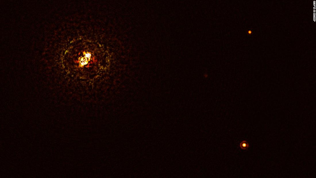 This image shows double-star system b Centauri and its giant planet b Centauri b. The star pair is the bright object at top left. The planet is visible as a bright dot in the lower right. The other bright dot (top right) is a background star.