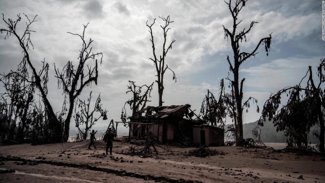 A part of the Sumberwuluh village is covered in ash on Sunday.