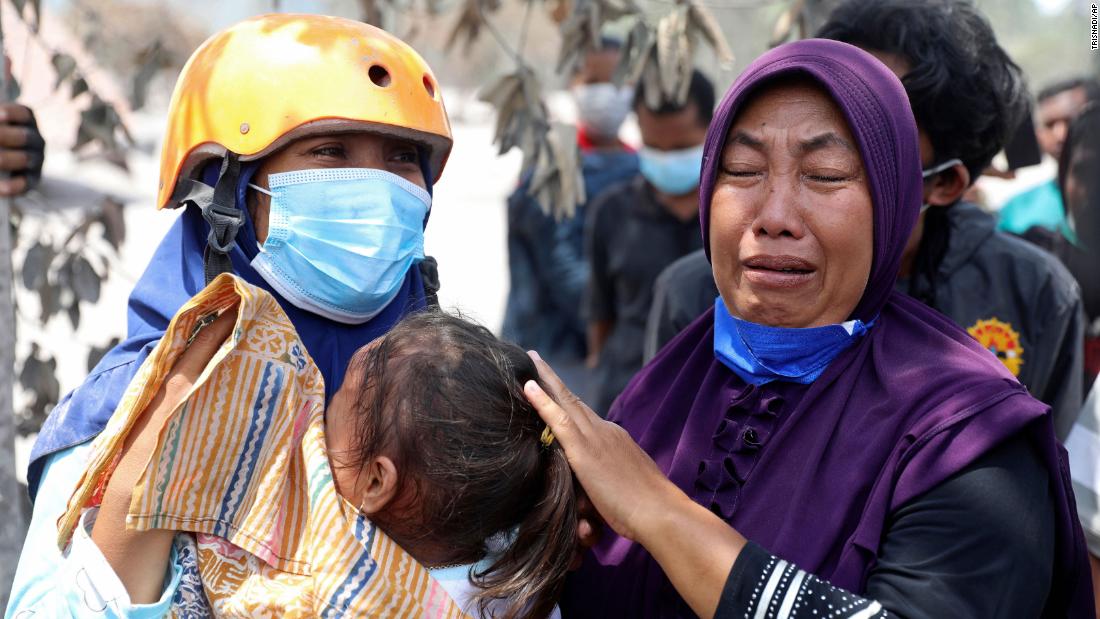 A woman weeps after her home was destroyed by the eruption of Mount Semeru in Candi Puro village, Lumajang, East Java, Indonesia, on Tuesday.