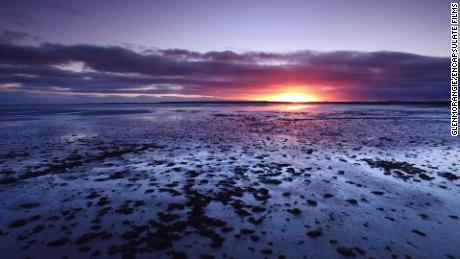 The sun rising over the Dornoch Firth, north of Inverness, Scotland. 