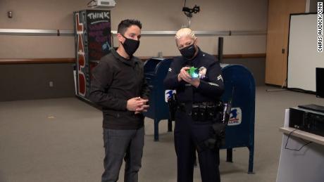 LAPD Officer Allison Ashnault shows CNN&#39;s Josh Campbell the firing of a Taser.