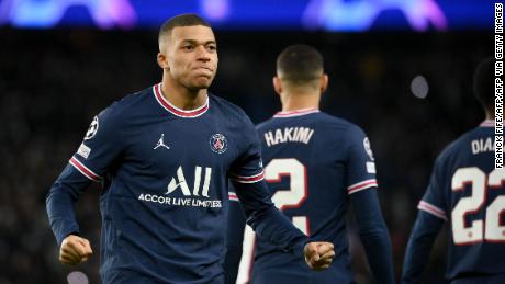 Kylian Mbappe celebrates after scoring his second goal against Club Brugge.