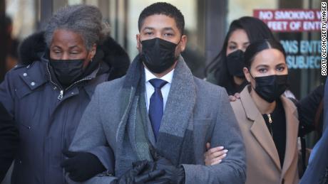 Jussie Smollett (center) leaves the Leighton Criminal Courts Building as the jury begins deliberation during his trial on December 8, 2021 in Chicago.