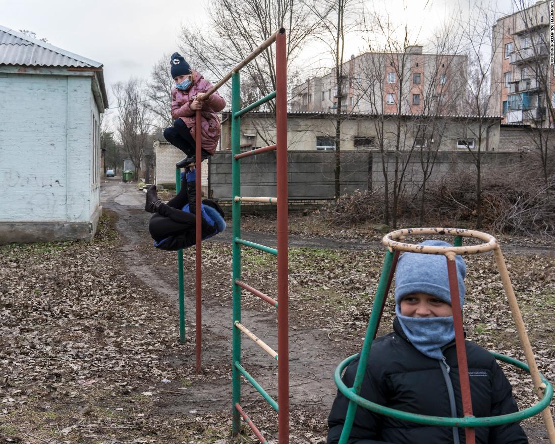 Students play while waiting for the bus after school in Krasnohorivka, Ukraine, on December 8.