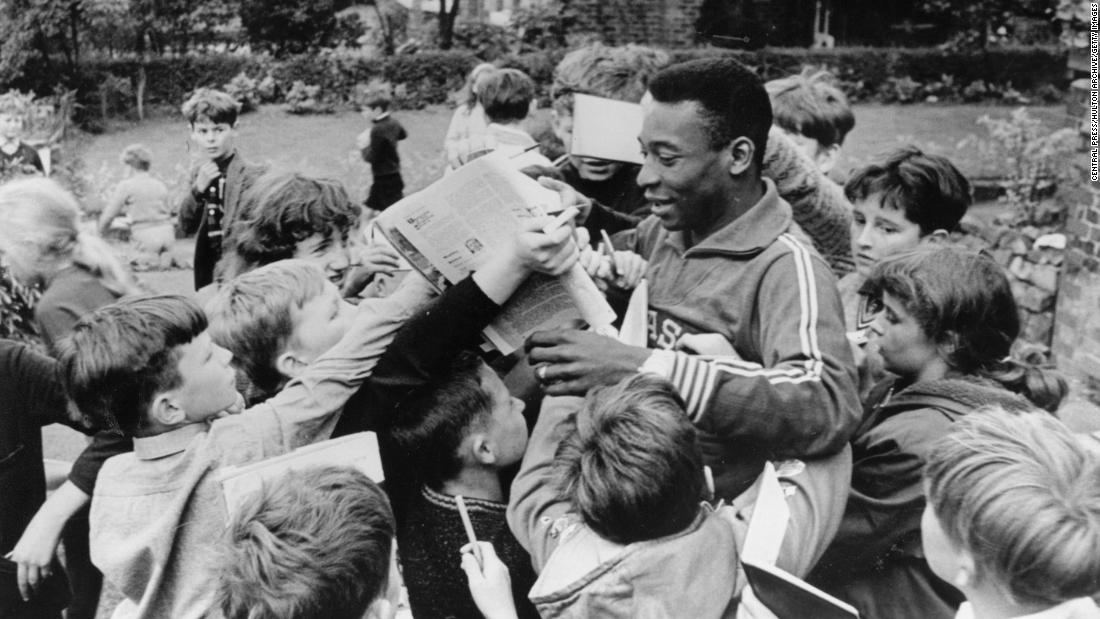 Pelé signs autographs for children in 1966. He played in the 1966 World Cup with Brazil but the team didn&#39;t advance out of the group stage that year.