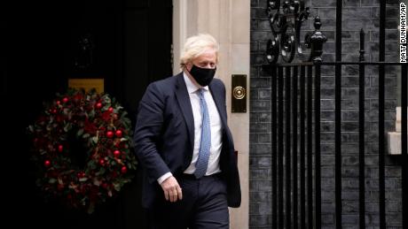 British Prime Minister Boris Johnson leaves 10 Downing Street to attend the Prime Minister's Weekly Questions in Parliament in London on Wednesday December 8, 2021. 