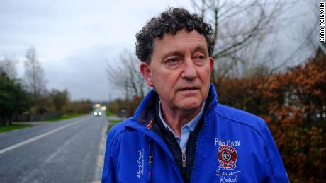 Councillor Johnny Flynn stands on the Tulla Road, which runs parallel to the proposed data center site in Ennis.