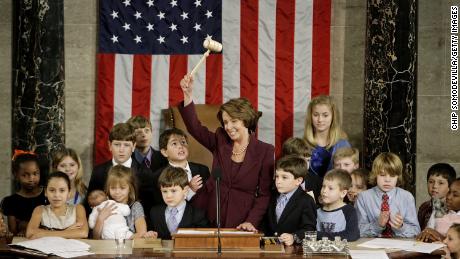 Pelosi waves the speaker&#39;s gavel while surrounded by her own grandchildren and the children of other members of Congress after being elected as the first woman speaker at a swearing in ceremony for the 110th Congress in January 2007.