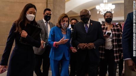 Pelosi walks with Majority Whip James Clyburn, right, who told CNN he&#39;s not interested in becoming speaker. 