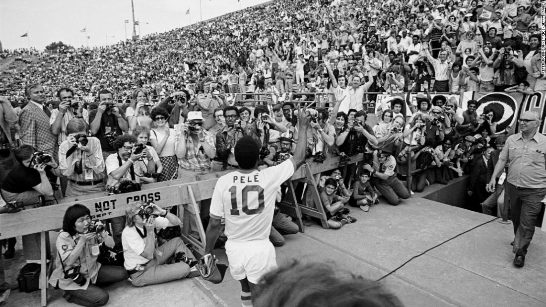 Pelé waves to the crowd before making his debut with the New York Cosmos in 1975. He signed a $1.4 million a year contract with the Cosmos and made a big splash in the emerging league.