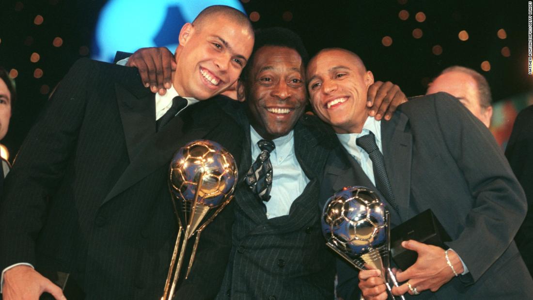 Pelé embraces two Brazilian stars -- Ronaldo, left, and Roberto Carlos -- after they finished first and second, respectively, for the 1997 FIFA World Player of the Year Award.