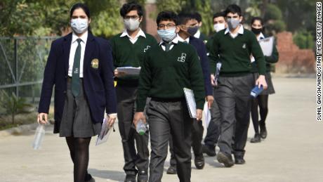 Students leave from an exam center after appearing for the Year 10 social science CBSE examination on November 30 in Noida, India.