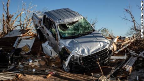 A truck was thrown onto the remains of a home during the tornado outbreak.