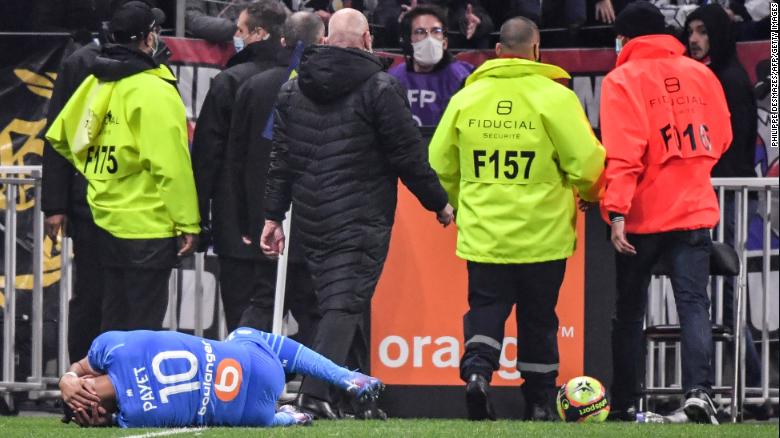 Marseille&#39;s Dimitri Payet is hit by a water bottle thrown from the crowd during a match against Lyon in November.