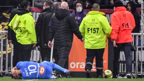 Marseille&#39;s Dimitri Payet is hit by a water bottle thrown from the crowd during a match against Lyon in November.