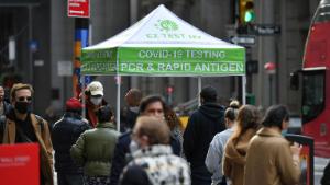 Photo by: NDZ/STAR MAX/IPx 2021 12/16/21 People wait in line to receive a COVID-19 test at a mobile COVID-19 testing site in the Financial District of Manhattan on December 8, 2021 in New York.