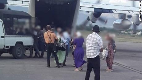 CNN obtained images of the released hostages boarding a US Coast Guard plane in Port-au-Prince, Haiti on Thursday. 