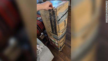 The Alfonso family has a long history of reusing the same fake Christmas tree box.