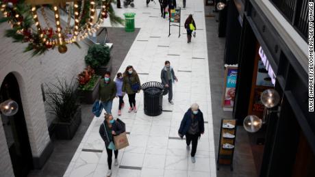 Shoppers walk through the Easton Town Center shopping mall in Columbus, Ohio, U.S., on Friday, Dec. 10, 2021. 