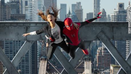 MJ (Zendaya) and Spider-Man (Tom Holland) jump off the bridge in &quot;Spider-Man: No Way Home.&quot;