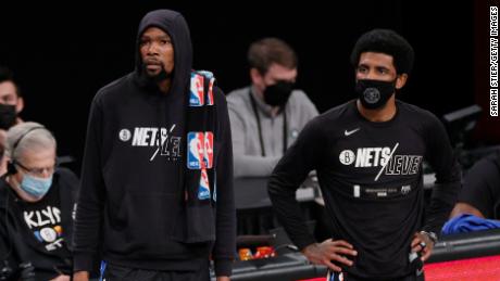Kevin Durant #7 and Kyrie Irving #11 of the Brooklyn Nets look on during the first half of Game Five of their Eastern Conference first round playoff series against the Boston Celtics at Barclays Center on June 01, 2021 in the Brooklyn borough of New York City .