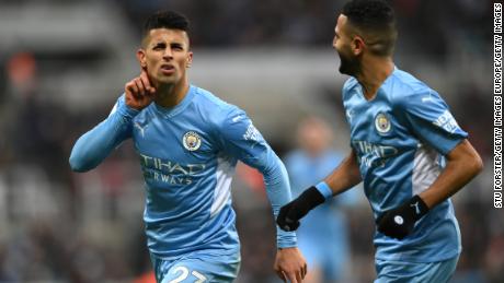 Joao Cancelo celebrates after scoring Manchester City&#39;s second goal against Newcastle.