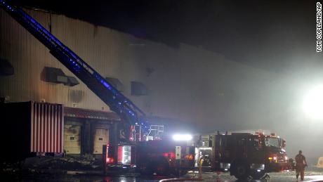 Firefighters work on cleanup after a fire ripped through a distribution center for the QVC home shopping television network in Rocky Mount, North Carolina.