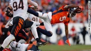 The Latest: Broncos' Bridgewater taken off on stretcher