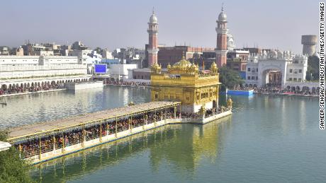 AMRITSAR, INDIA - DECEMBER 19: Devotees pay obeisance at Golden Temple, on December 19, 2021  in Amritsar, India. (Photo by Sameer Sehgal/Hindustan Times via Getty Images)