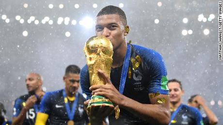 Kylian Mbappe of France celebrates with the World Cup trophy following the 2018 FIFA World Cup Final between France and Croatia.