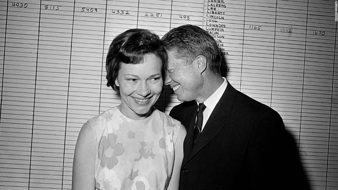 Jimmy Carter, then a Georgia state senator, hugs his wife at his campaign headquarters in Atlanta in 1966.