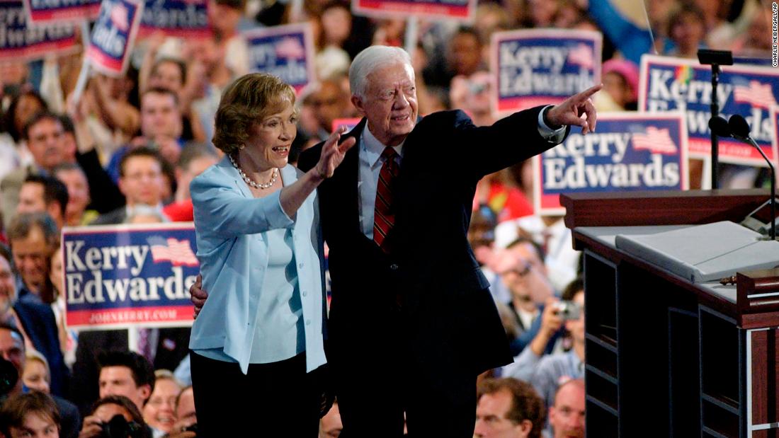 The Carters wave to delegates during the Democratic National Convention in 2004.