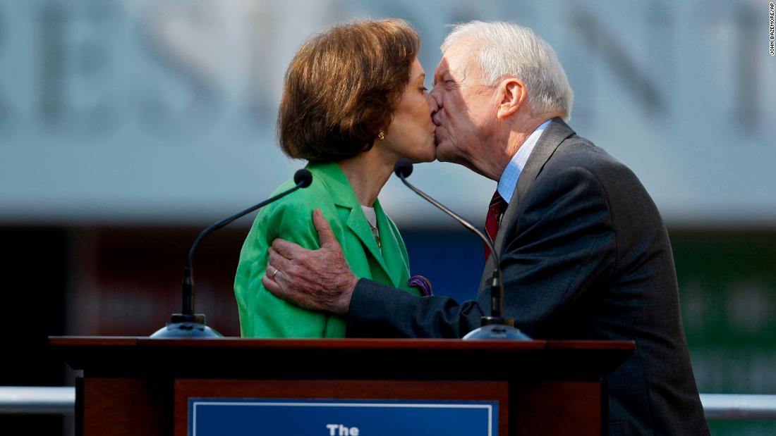 The Carters kiss in October 2009 as Rosalynn introduces her husband at the ceremony for the redesigned Carter Presidential Library in Atlanta.