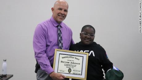 The Muskogee Police Department presented Davyon Johnson with an honorary officer certificate.