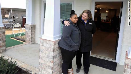 Janet V. Green, right, welcomes April Stringfield, left, to her new home.