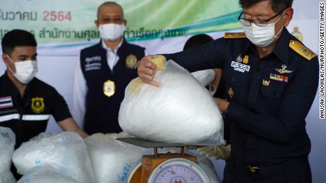 Thai Director-General of Customs, Patchara Anuntasilpa (R) displays items from seized crystal methamphetamine worth 116 million Thai baht (about 3.44 million US dollars or 3.04 million euro) after Thai customs intercepted packages headed for Australia, in Bangkok, Thailand, 23 December 2021. 