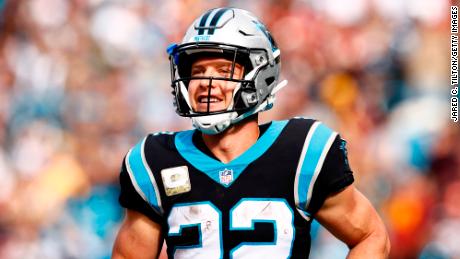 Christian McCaffrey, seen here celebrating a touchdown during a game in November, paid off the accounts of 363 families.
