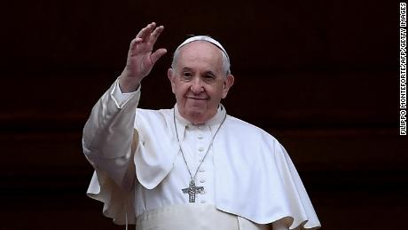 Pope Francis waves following his Christmas blessing in St. Peter&#39;s Square on December 25, 2021. 