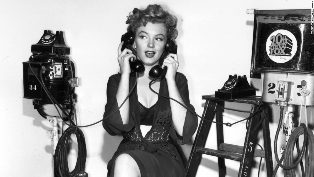 Holding two telephones, Monroe poses at the 20th Century Fox film set. In 1956, she starred in the drama &quot;Bus Stop.&quot; She played a saloon singer with an Ozark accent. &quot;She did the hardest thing to do. She chose to play it like somebody who is not very good at what they do but trying really hard to be good,&quot; said actress Ellen Burstyn. 